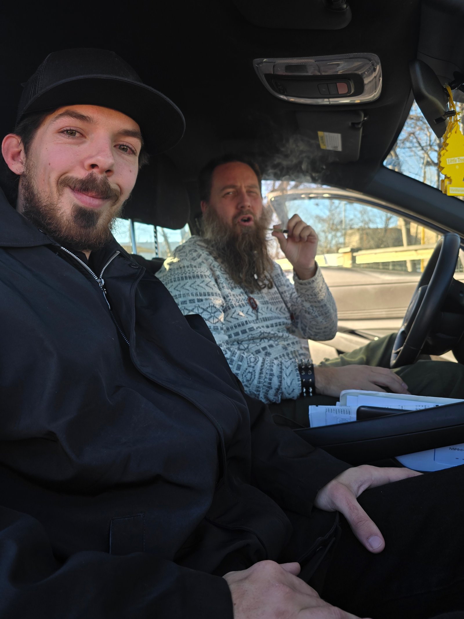Two band members in a car