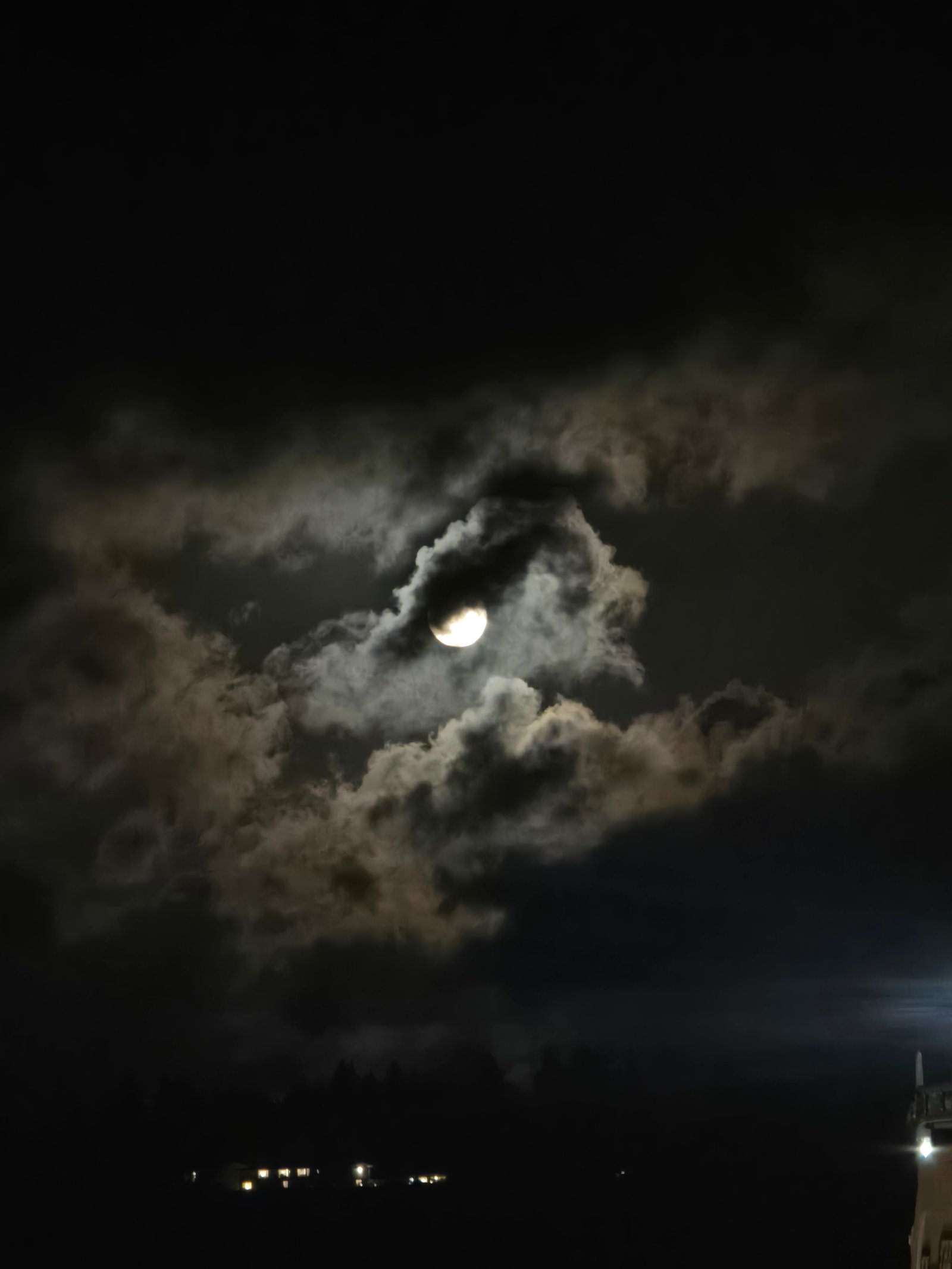 Moon breaking through clouds after the show — Astoria OR